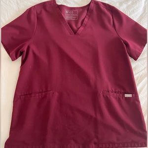 Like new XL burgundy Casma three-pocket scrub top. Only worn twice.